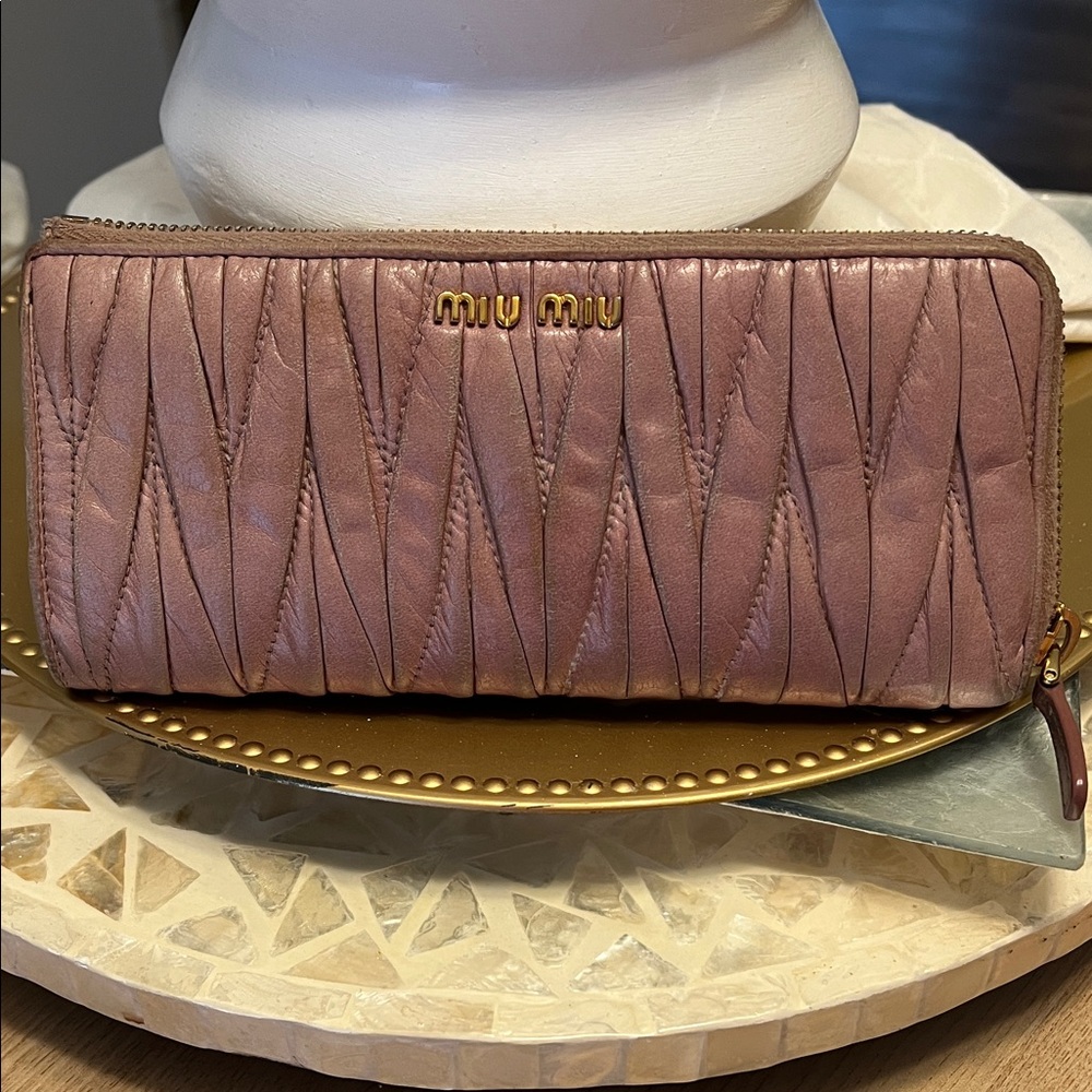 Authentic Miu Miu Matelassé long zip-around wallet in the color Orchid.